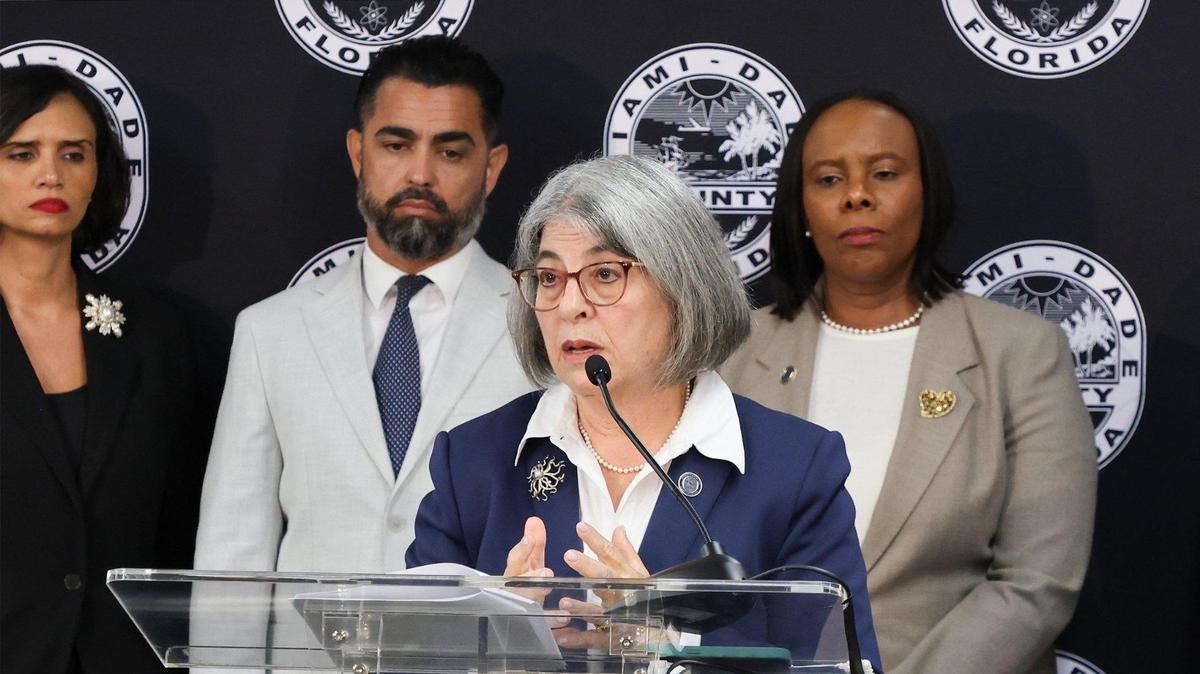 Mayor Daniella Levine Cava unveils her 2026 budget proposal, which includes cuts to park services and charity grants in order to close a projected deficit of more than $400 million, as members of her administration stand near on Tuesday, July 15, 2025, in Miami.