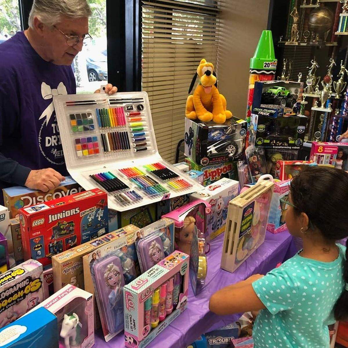 Miami-Dade County Public School Board Member Larry Feldman, left, recently partnered with the Edge Foundation to host a toy drive event at Blakey Park in Homestead.