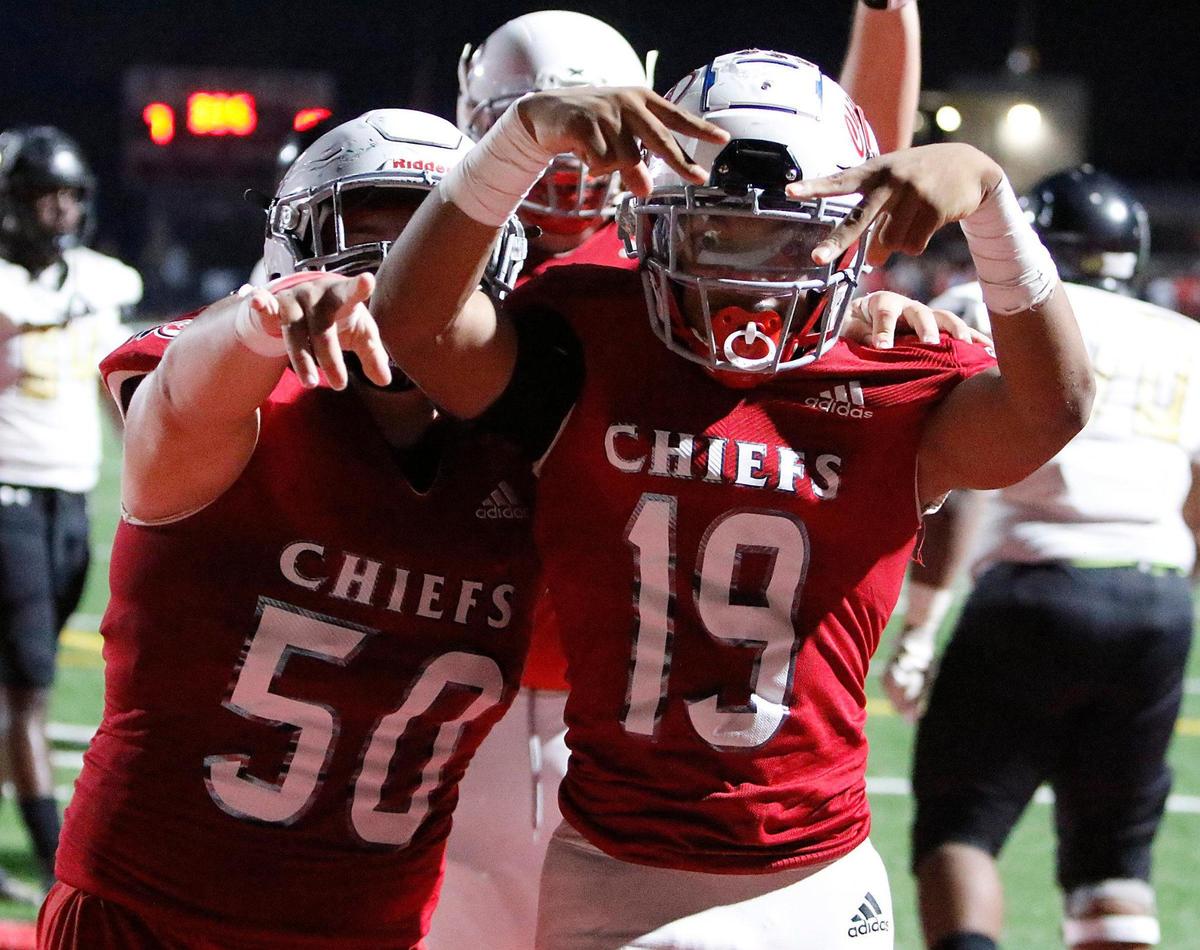 Cardinal Gibbons Chiefs running back Kamari Moulton (19) celebrates a touchdown against Lakewood Spartans during the 2021 FHSAA Class 4A high school football semifinal game on Friday, December 3, 2021 at Cardinal Gibbons HS in Fort Lauderdale. Andrew Uloza / for THE MIAMI HERALD