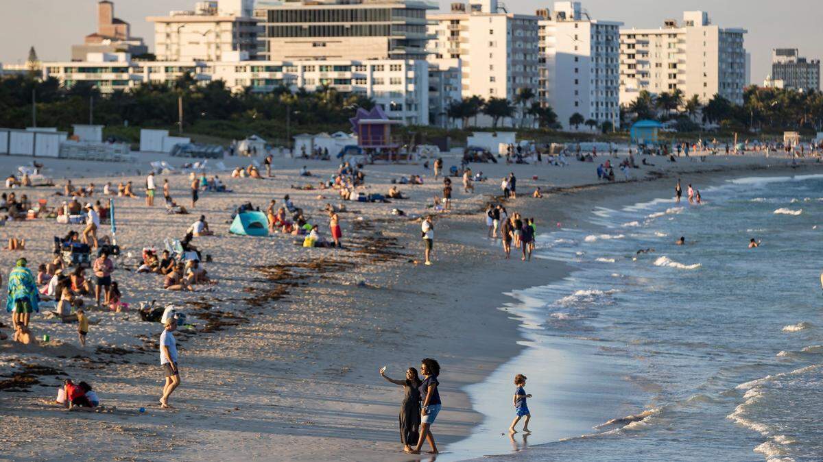 People visit South Pointe Beach on Monday, Feb. 27, 2023, in Miami Beach, Forida.