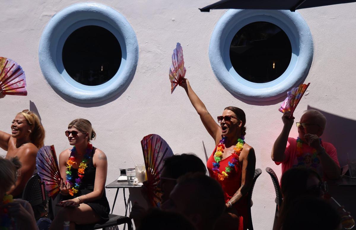 Patrons of the Palace show their support for parade participants on Sunday, April 16, 2023.