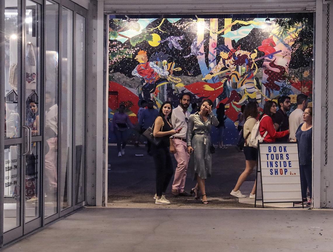 Wynwood Walls visitors walk through the outdoor gallery on Sunday, November 25, 2019.