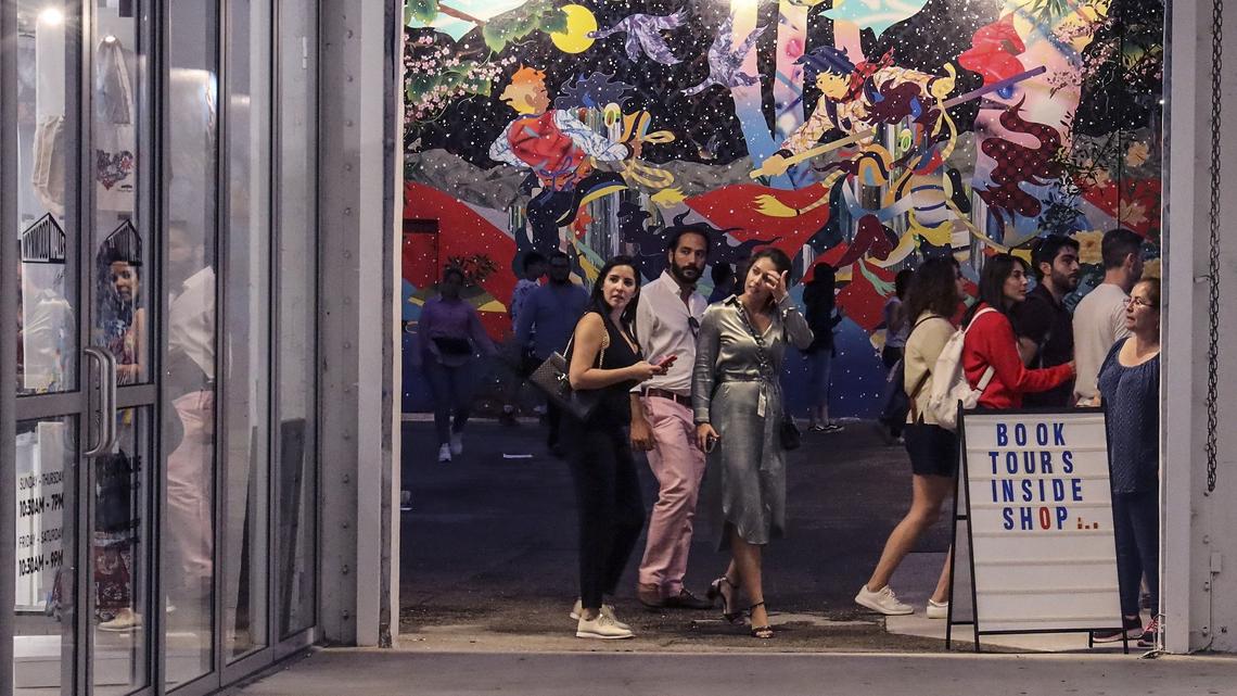 Wynwood Walls visitors walk through the outdoor gallery on Sunday, November 25, 2019.