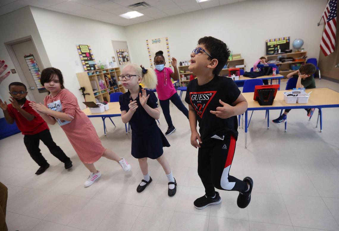 Miami Lighthouse for the Blind and Visually Impaired has a new initiative to help kids diagnosed with CVI, the No. 1 cause of bilateral visual impairment in children in the developed world. Second-grade students take a break from classwork to dance and sing a holiday song on Monday, Dec. 6, 2021. Students are, from left, front row, Jowayne Palmer, Samantha Cortez, Gianni Bivens and Lorenzo.
