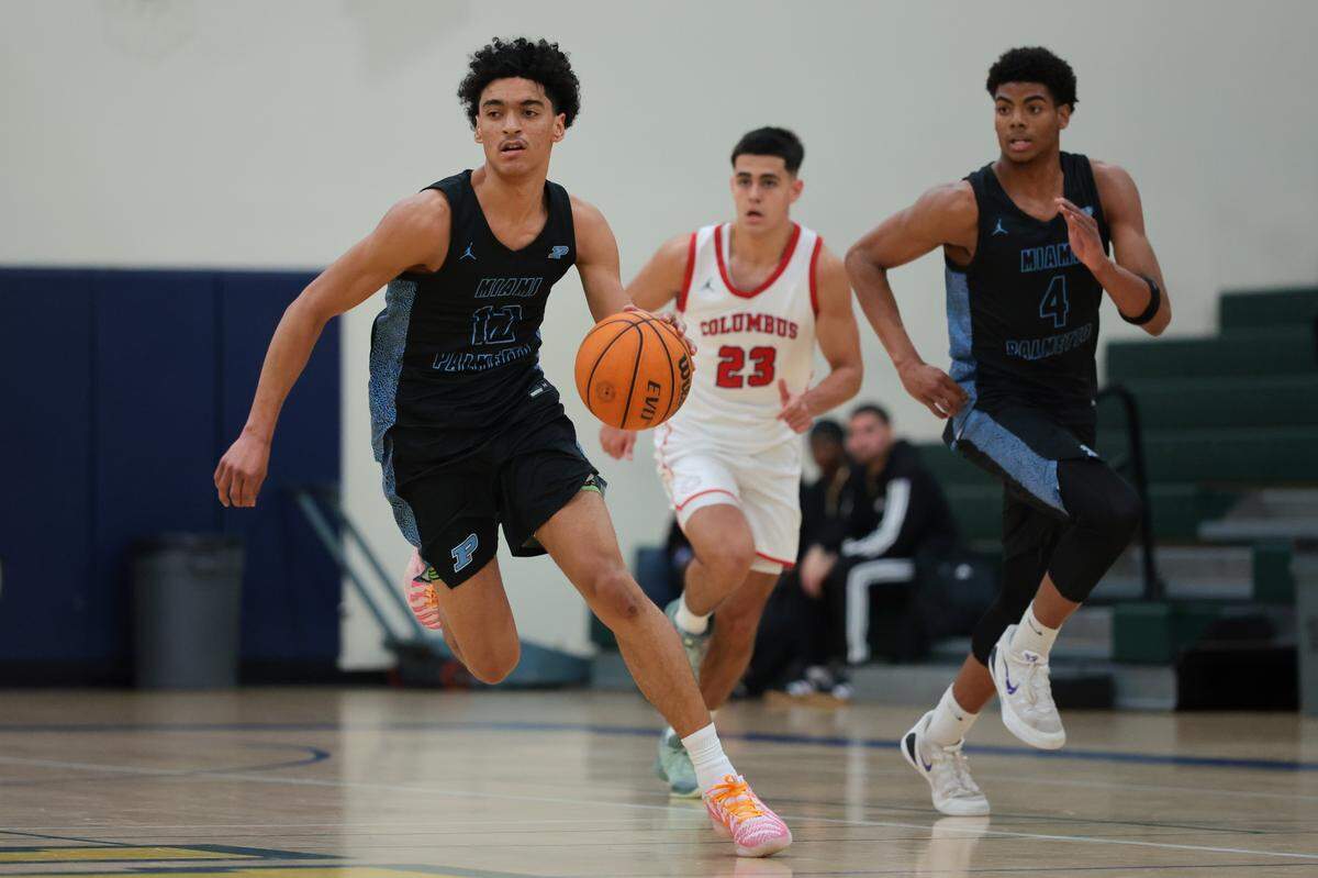 Palmetto Panthers guard Samfree Sarante (12) drives to the basket against the Columbus Explorers during the first quarter of a Greater Miami Athletic Conference boys basketball finals game at Ronald W. Reagan Doral Senior High School on Saturday, Jan. 24, 2026, in Doral, Fla.