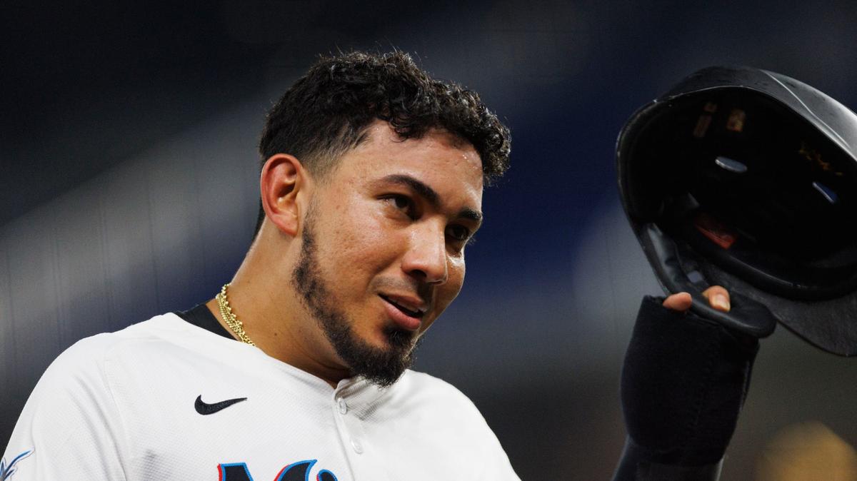Miami Marlins catcher Jhonny Pereda (89) takes his helmet off while coming into the dugout after hitting his first ball for the Marlins during the third inning of a baseball game on Thursday, Aug. 8, 2024, at loanDepot Park in Miami.