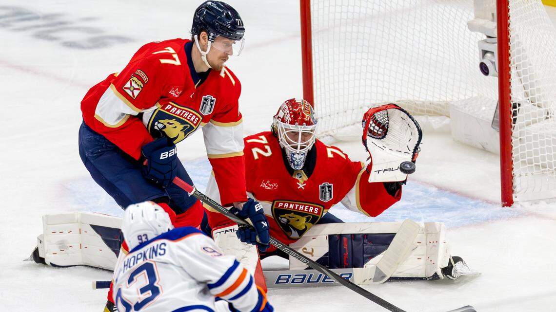 Florida Panthers defenseman Niko Mikkola (77) helps defend as goaltender Sergei Bobrovsky (72) blocks a shot by Edmonton Oilers center Ryan Nugent-Hopkins (93) during the first period of Game 3 in the Stanley Cup Final at Amerant Bank Arena on Monday, June 9, 2025, in Sunrise, Fla.