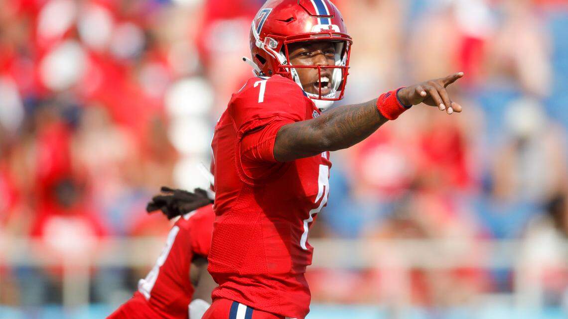 Florida Atlantic Owls quarterback N’Kosi Perry (7) points at his teammates during the first quarter of the Shula Bowl game against Florida International University at FAU Stadium in Boca Raton, Florida on Saturday, October 2, 2021.