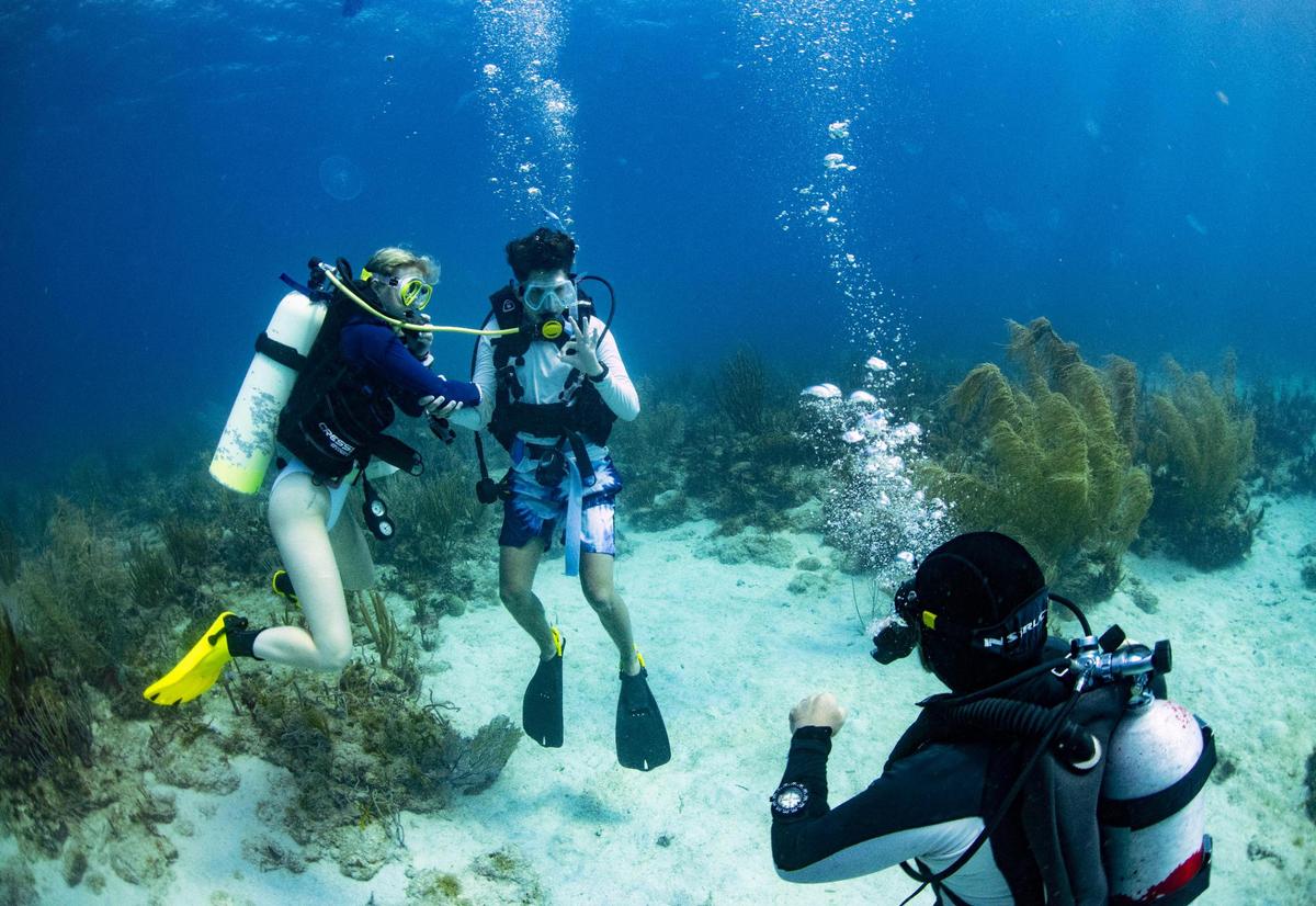 Andrew Tsagaroulis, center, from West Broward High School, completes his check out dive with a dive buddy on Sunday, July 31, 2022, at Mountain Point in the British Virgin Islands. Tsagaroulis is getting his new certification, so the camp had to make sure he was qualified enough to be a certified open water diver.