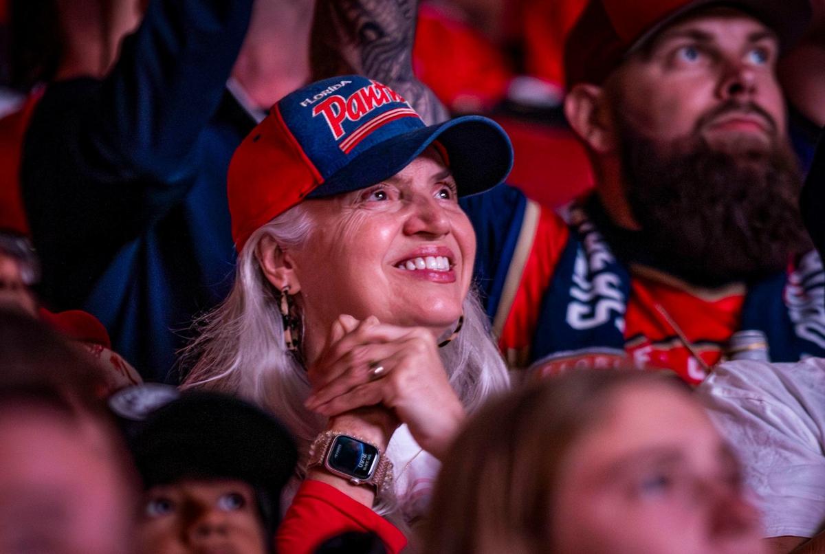 A Florida Panthers fan is all smiles she watches early game action of Game 4 of the Stanley Cup Final.