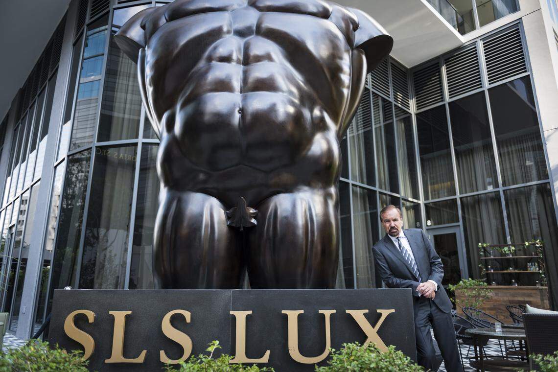 Jorge Pérez, chairman and CEO of The Related Group, poses with the Botero sculpture that sits outside SLS Lux Brickell, his company’s latest project, a 57-story luxury condo and hotel at 805 S. Miami Avenue.