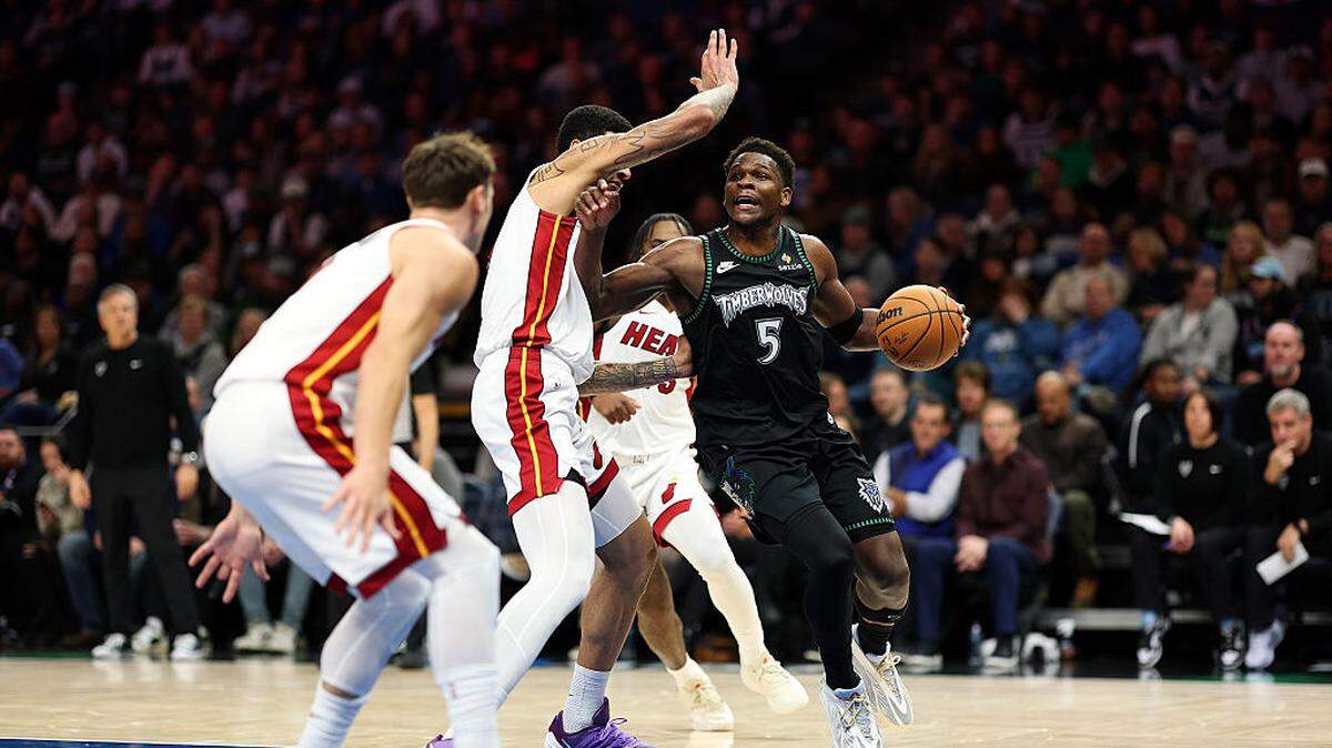 Anthony Edwards #5 of the Minnesota Timberwolves goes to the basket against Kel'el Ware #7 of the Miami Heat in the second quarter at Target Center on January 06, 2026 in Minneapolis, Minnesota.
