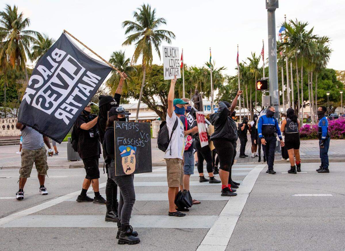 Protestors hold up traffic on Biscayne Boulevard and NE 3rd Street during a protest by South Florida activists, to get justice for Ma’khia Bryant, who was killed by police in Columbus, Ohio, at the Simon Bolivar Monument in Downtown Miami, Florida, on Saturday, April 24, 2021.
