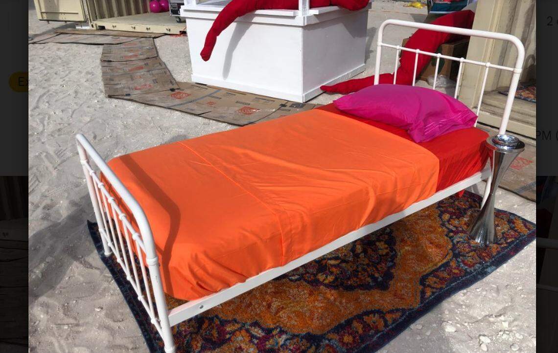 Bed on sand at Satellite art show in Indian Park Beach