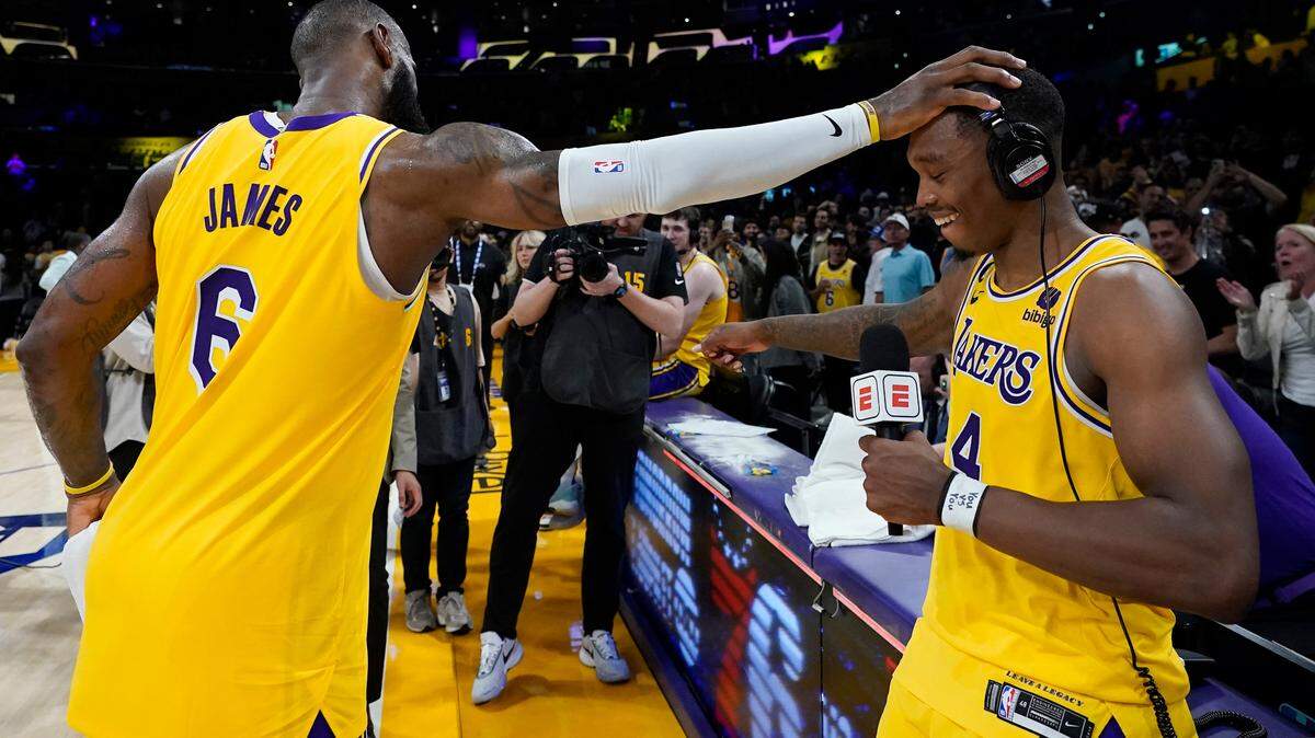 Los Angeles Lakers’ LeBron James, left, congratulates Lonnie Walker IV after the Lakers defeated the Golden State Warriors 104-101 in Game 4 of an NBA basketball Western Conference semifinal Monday, May 8, 2023, in Los Angeles. (AP Photo/Marcio Jose Sanchez)