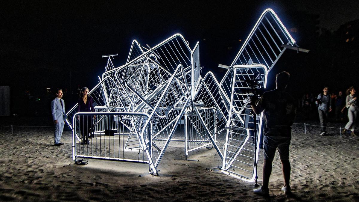 Cuban-American artists Antonia Wright and Rubén Millares (far left), stand by their piece titled titled “Patria y Vida” a large-scale light sculpture that celebrates people’s right to peacefully protest including Cuba where many were sentenced to prison after the anti-government protests that took place on July 11th, 2021. This project is part of the City of Miami Beach’s A No Vacancy Project in partnership with Faena Art, for the Miami Art Week 2022, on Tuesday November 12, 2022.