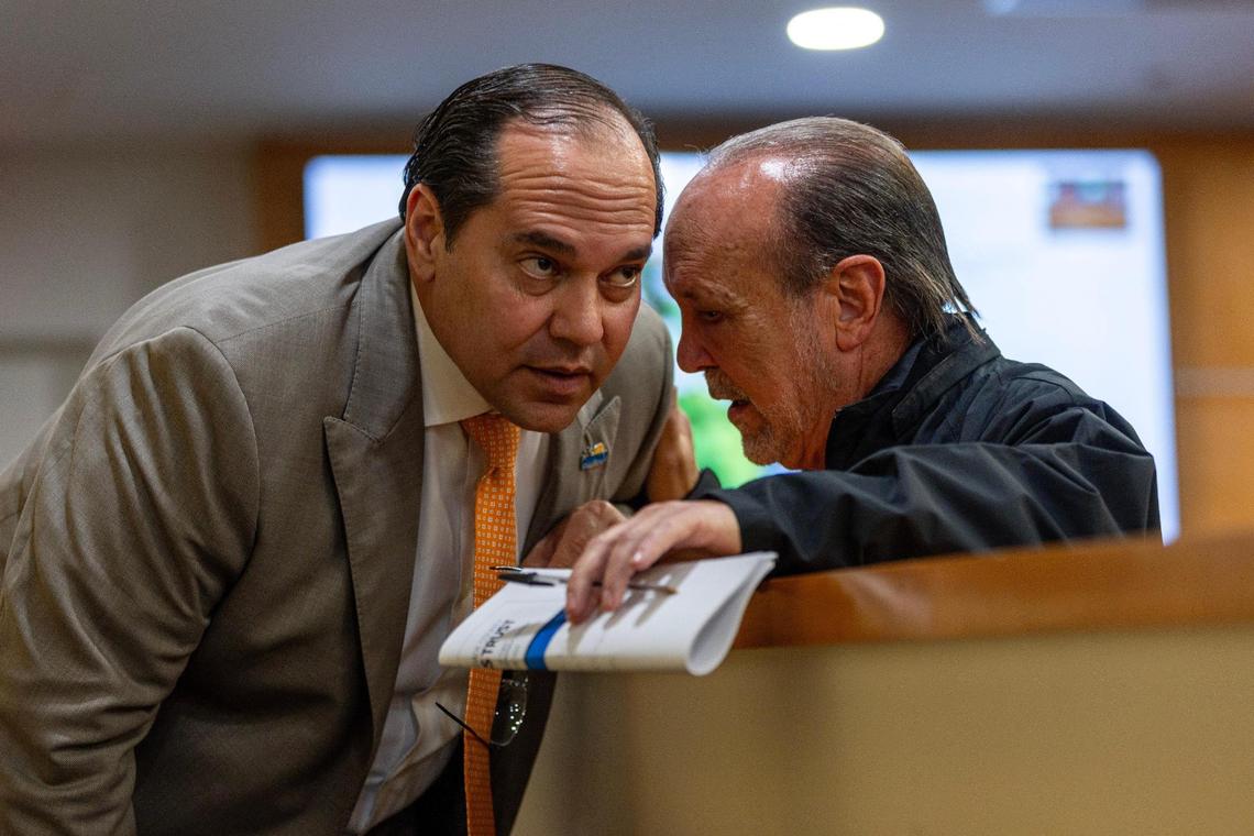 Miami-Dade County Homeless Trust Chairman Ron Book, right, speaks with Cutler Bay Town Manager Rafael G. Casals during a Nov. 29, 2023, town council workshop about the agency’s plan to convert a La Quinta Inn motel into affordable apartments for the formerly homeless.