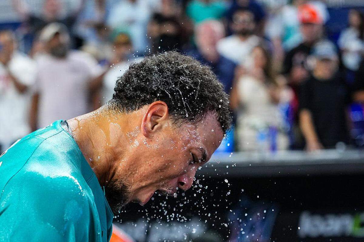 MIAMI, FLORIDA - MAY 24: Heriberto Hernández #13 of the Miami Marlins gets showered with sports drink after hitting a walk-off grand slam in the ninth inning againt the New York Mets at loanDepot park on May 24, 2026 in Miami, Florida. (Photo by Rich Storry/Getty Images)