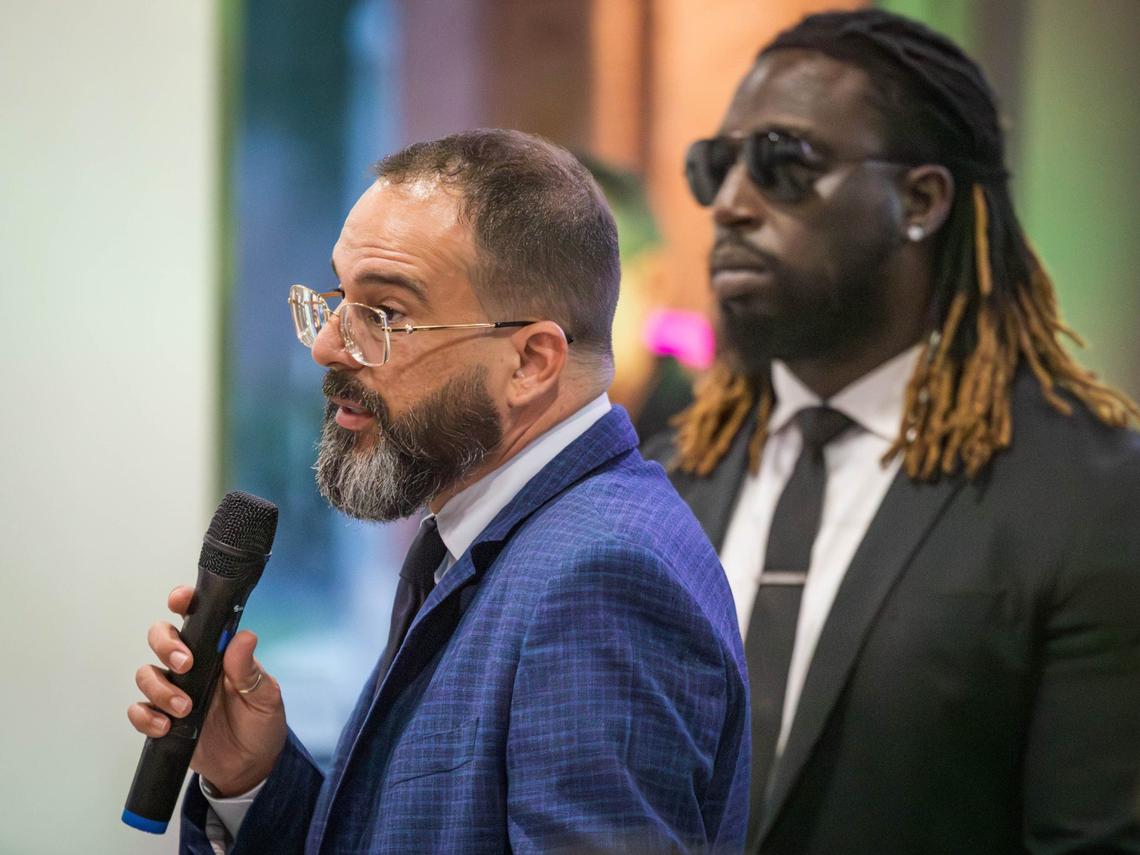 Miami-Dade County mayoral candidate Alexander Otaola speaks at a community outreach event on Venezuelan issues held at El Tropico restaurant, where he is accompanied by his bodyguard for added security.