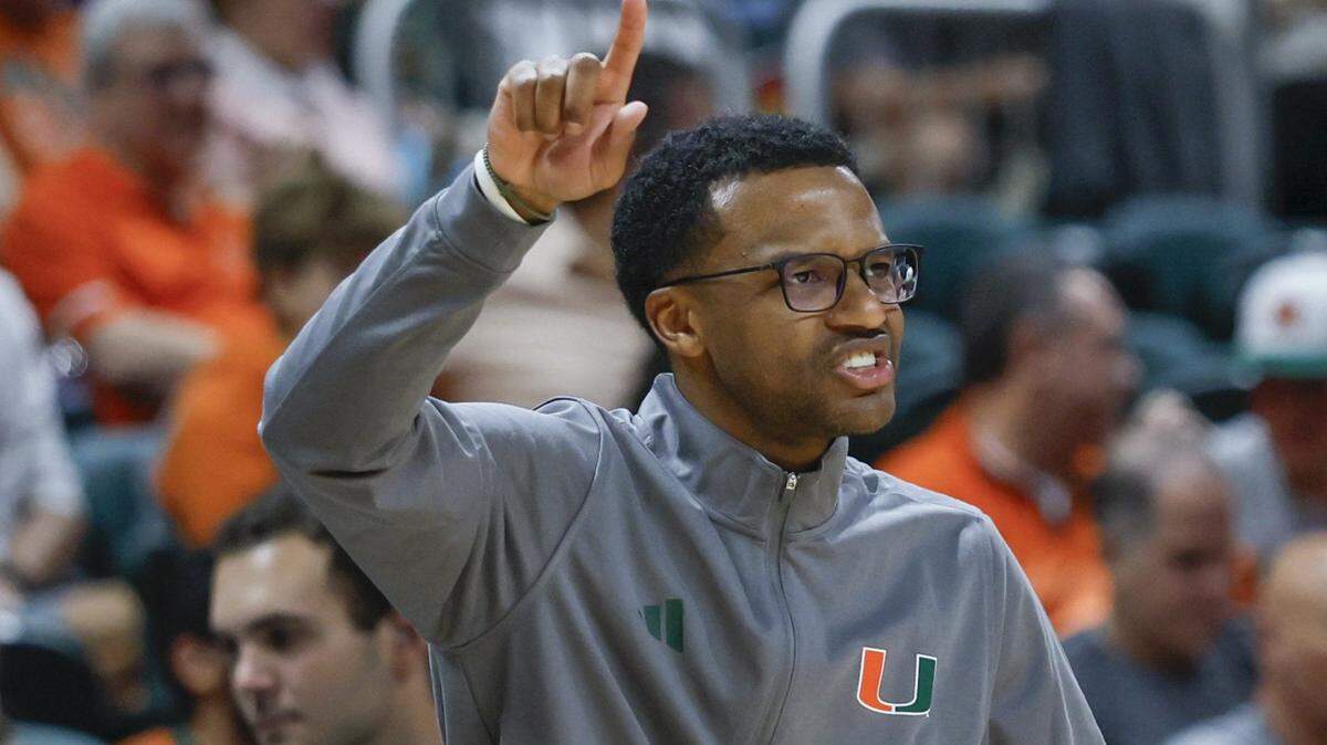 Miami Hurricanes head coach Jai Lucas signals towards the court during the second half of an NCAA basketball game against the Georgia Tech Yellow Jackets at the Watsco Center on the University of Miami Campus on Saturday, January 10, 2026 in Coral Gables, Florida.