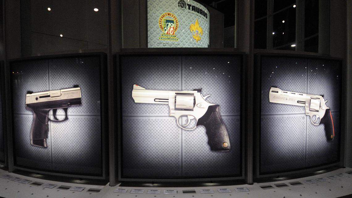 Display panels are illuminated at the Taurus International Manufacturing booth at the 139th NRA Annual Meetings and Exhibits at the Charlotte Convention Center in 2010.