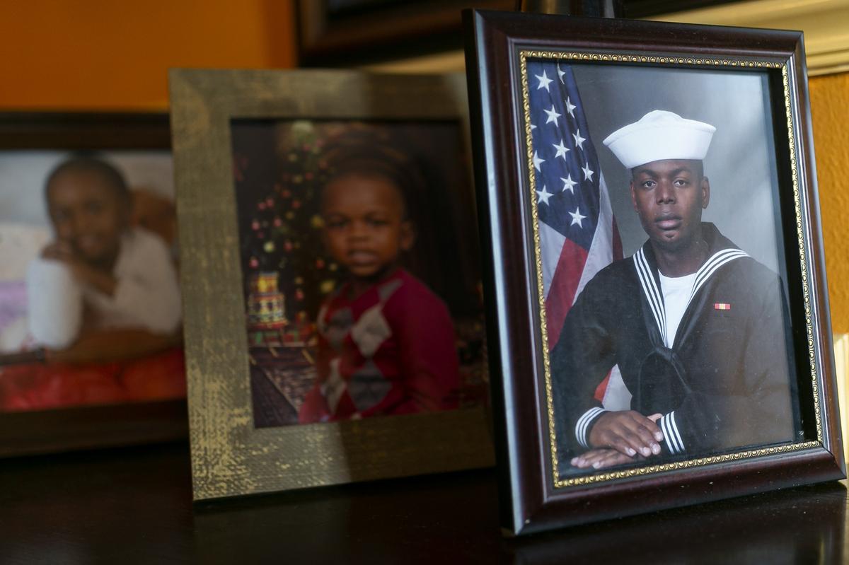 A photograph of Frantz Roseus during his service with the U.S. Navy is seen at his home in Miramar, Florida on Saturday, December 14, 2019. Frantz has no working kidneys and faces millions in medical debt due to complications from his transplant surgery.