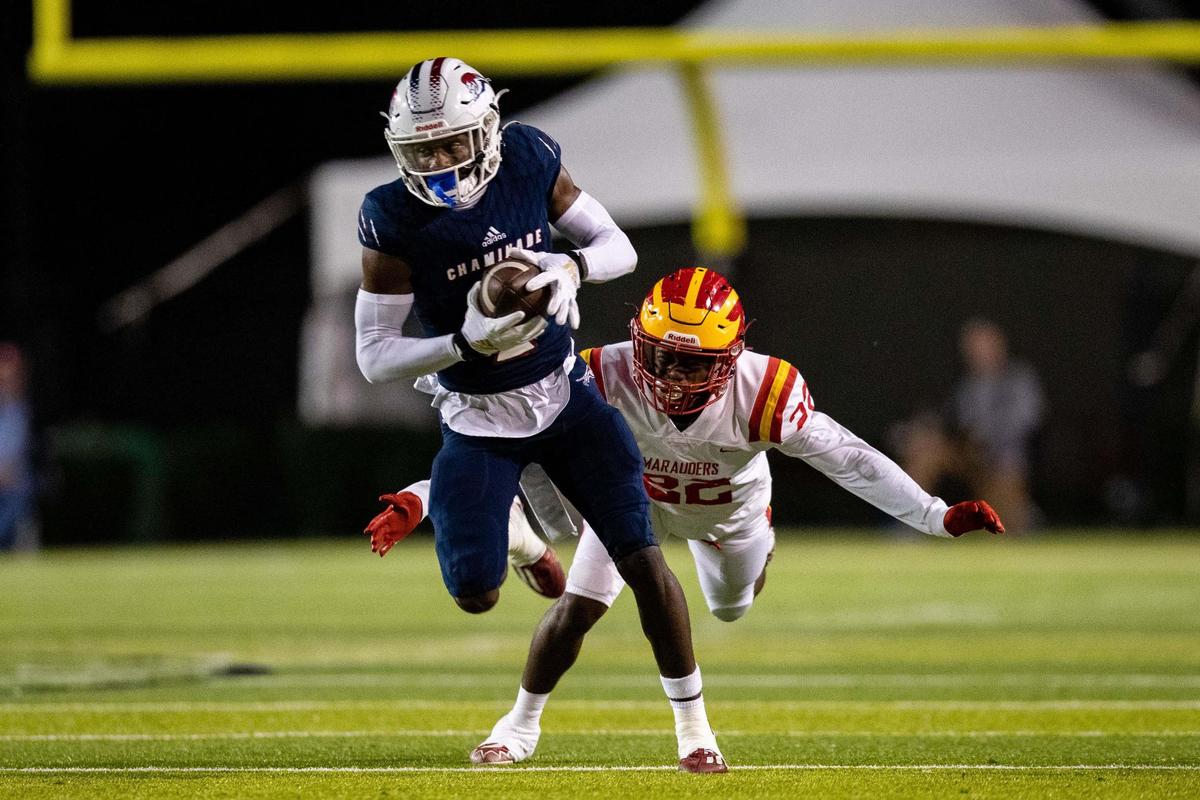 Chaminade wide receiver Edwin Joseph (2) catches a pass from quarterback Cedrick Bailey (11). The Chaminade Lions lead the Clearwater Central Catholic Marauders 28-0 at the half of the Class IM State Championship game at Gene Cox Stadium in Tallahassee, Florida on Thursday, Dec. 8, 2022.