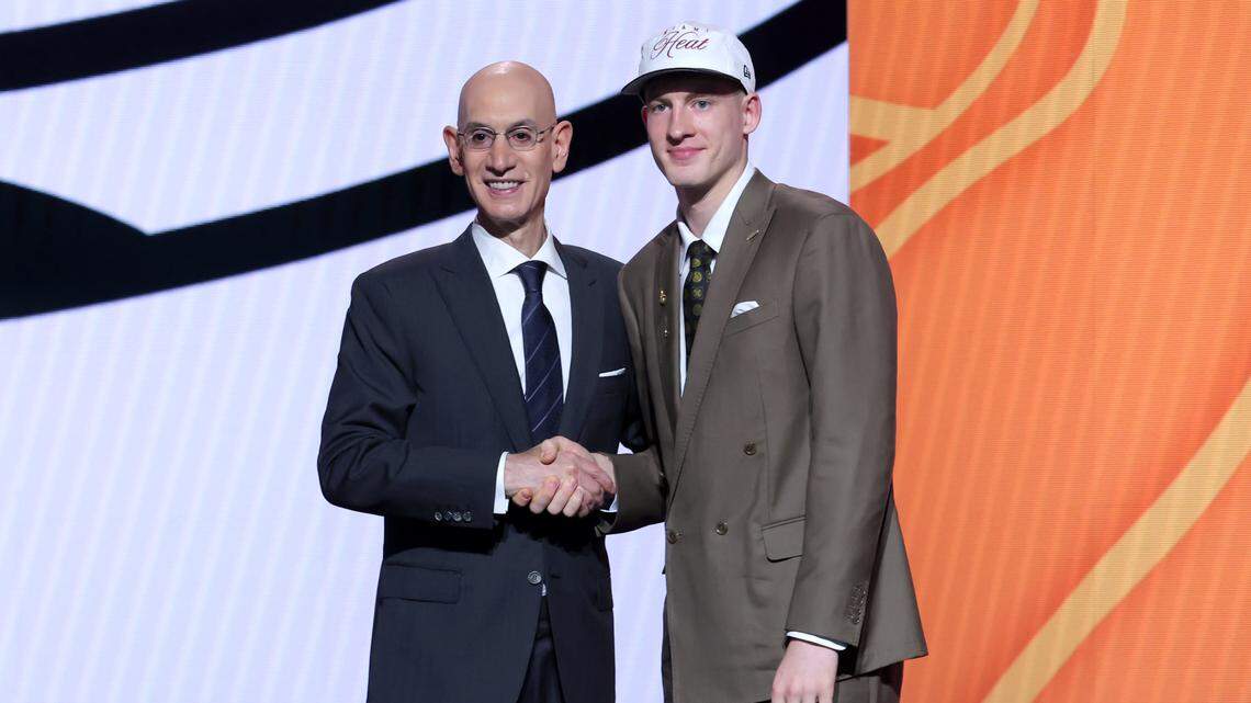 Kasparas Jakucionis stands with NBA commissioner Adam Silver after being selected as the 20th pick by the Miami Heat in the first round of the 2025 NBA Draft at Barclays Center.