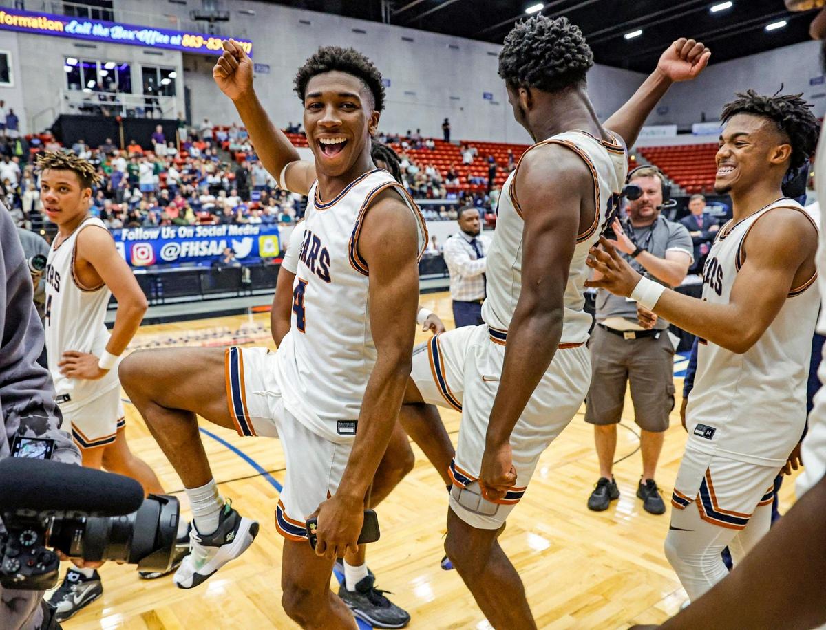 Mater Lakes Academy’s Ian Pascal (4) and Christian Reid (15) dance as they celebrate with teammates after defeating The Villages Charter during the FHSAA Class 4A State Championship at the RP Funding Center in Lakeland, Florida on Saturday, March 4, 2023.