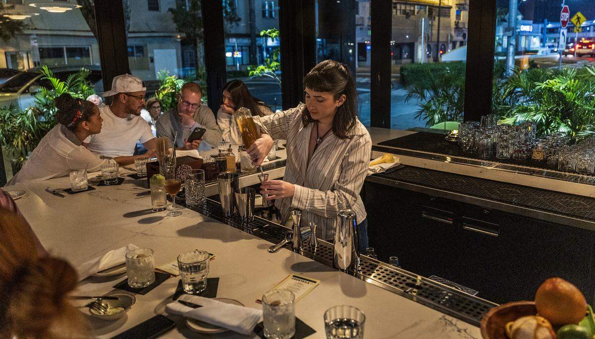 Bartender Jackie Rey prepares some drinks at the bar of the recently opened Tin Tin, Cuban Cuisine Restaurant in Little Havana, by chefs, partners, owners, Sachi Statz, and Victor Santos, on Friday January 09, 2026.