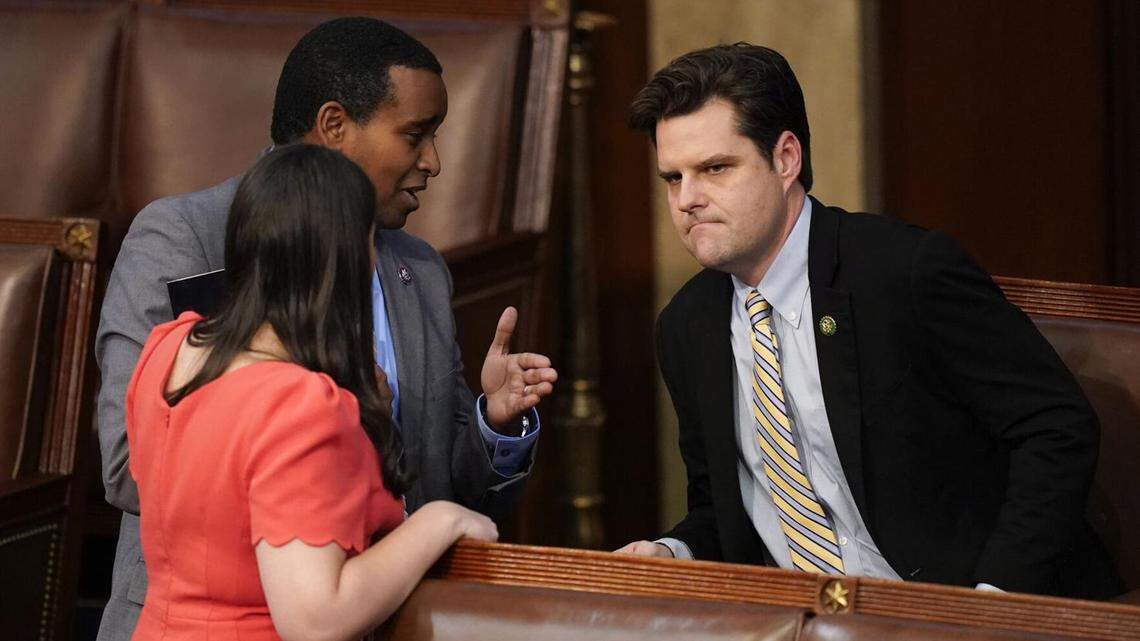 Rep. Matt Gaetz, R-Florida, right, talks with colleagues during the 11th vote in the U.S. House to choose a speaker.