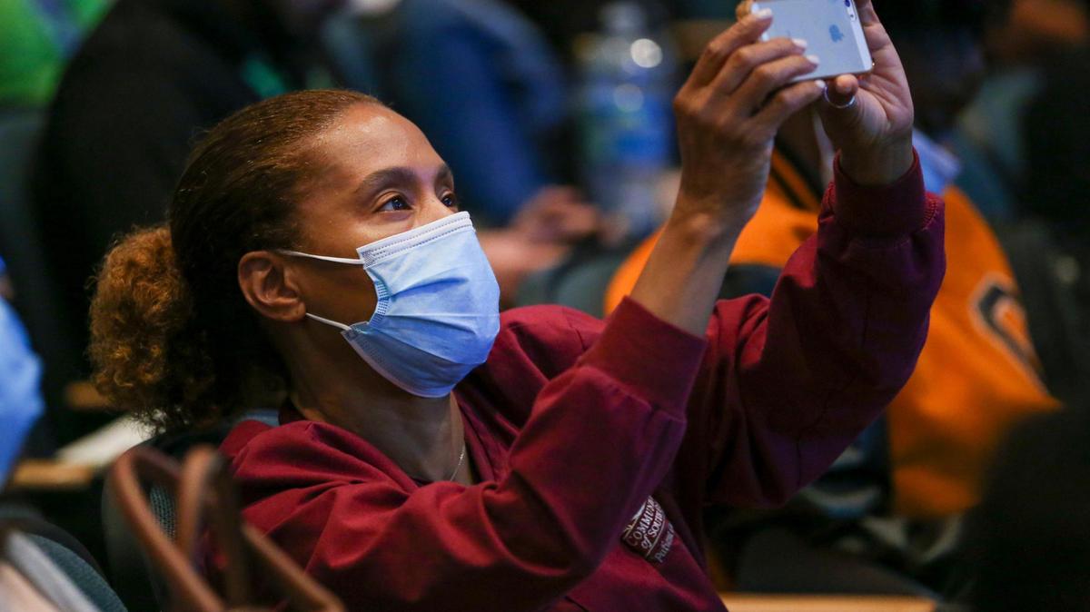 Leyda Fiscella, a registered nurse with Community Health of South Florida through The Children’s Trust takes a photo while attending a conference about school safety and mental wellness at Ronald W. Reagan Doral Senior High School, in Doral, Florida, on Wednesday, Aug. 3, 2022.
