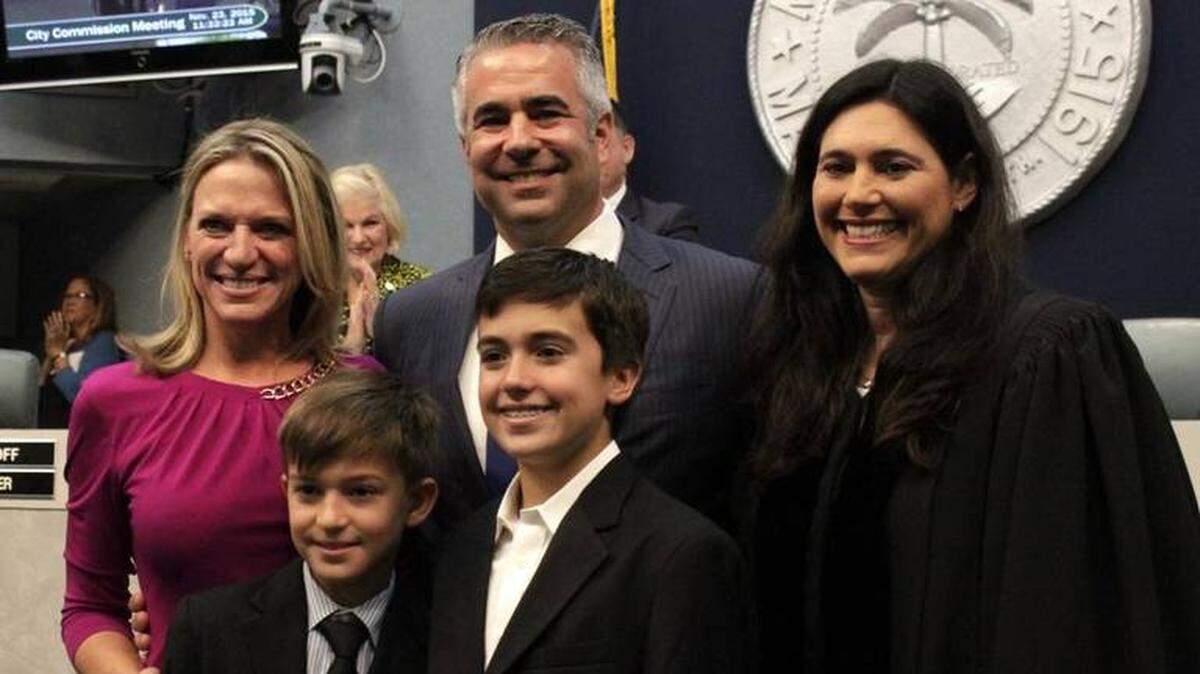Commissioner John Elizabeth Alemán, left, poses with her husband JB, sons Evan and Jake and Judge Mindy Glazer, who swore her in on November 23, 2015.