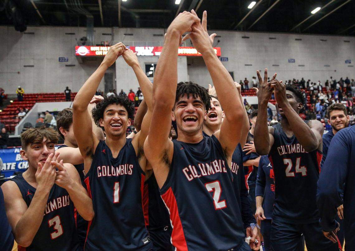 Columbus guard Cayden Boozer (2) is joined by teammates their fingers in anticipation of a championship ring after defeating Dr. Phillips 45-44 in the Florida High School Athletic Association Class 7A boys basketball state championship at the RP Funding Center in Lakeland on Saturday, March 5, 2022.