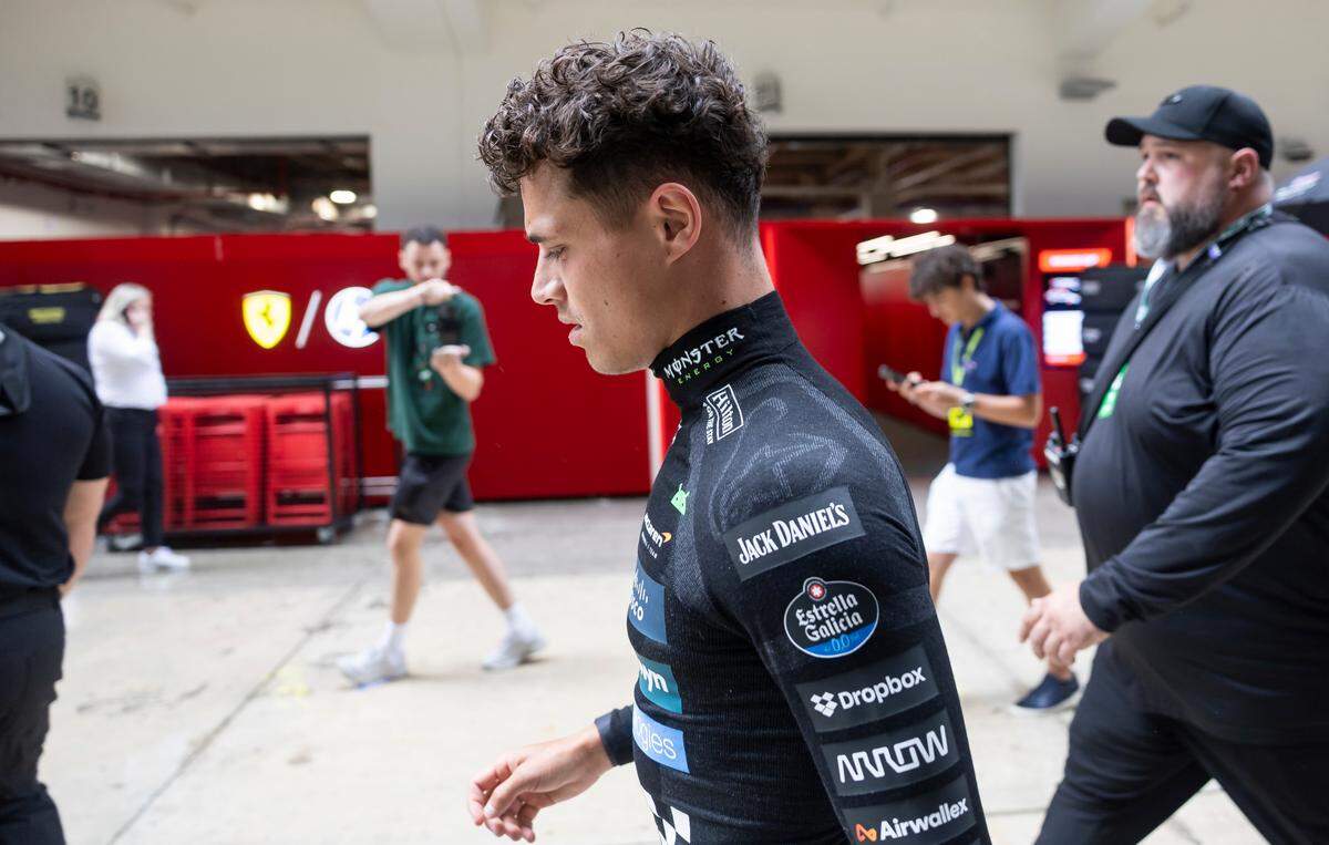 McLaren driver Lando Norris of Britain walks toward his garage before the start of a Sprint race on the second day of the Formula One Miami Grand Prix at the Miami International Autodrome on Saturday, May 3, 2025, in Miami Gardens, Fla.