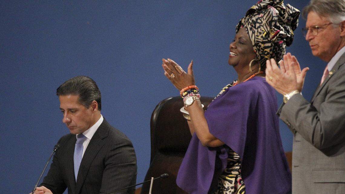 School board members Dr. Dorothy Bendross-Mindingall and Dr. Lawrence S. Feldman lead a standing ovation as Alberto Carvalho, superintendent of Miami-Dade County Public Schools, announced his decision to stay in Miami-Dade instead of going to New York City during a packed School Board meeting on Thursday, March 1, 2018.