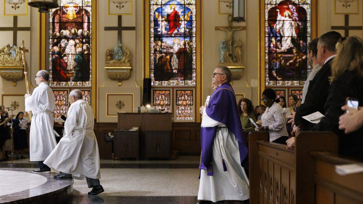 Since President Donald Trump and Pope Leo XIV exchanged words over the war in Iran, some Catholics in Miami have had to negotiate their political and religious beliefs. Picture here is mass at Gesu Catholic Church in downtown Miami. 