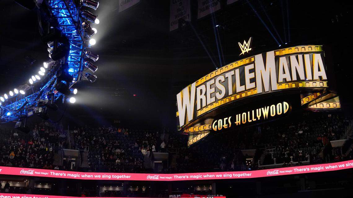 In this file photo, a WrestleMania sign hangs over the crowd during the WWE Monday Night RAW event, Monday, March 6, 2023, in Boston.