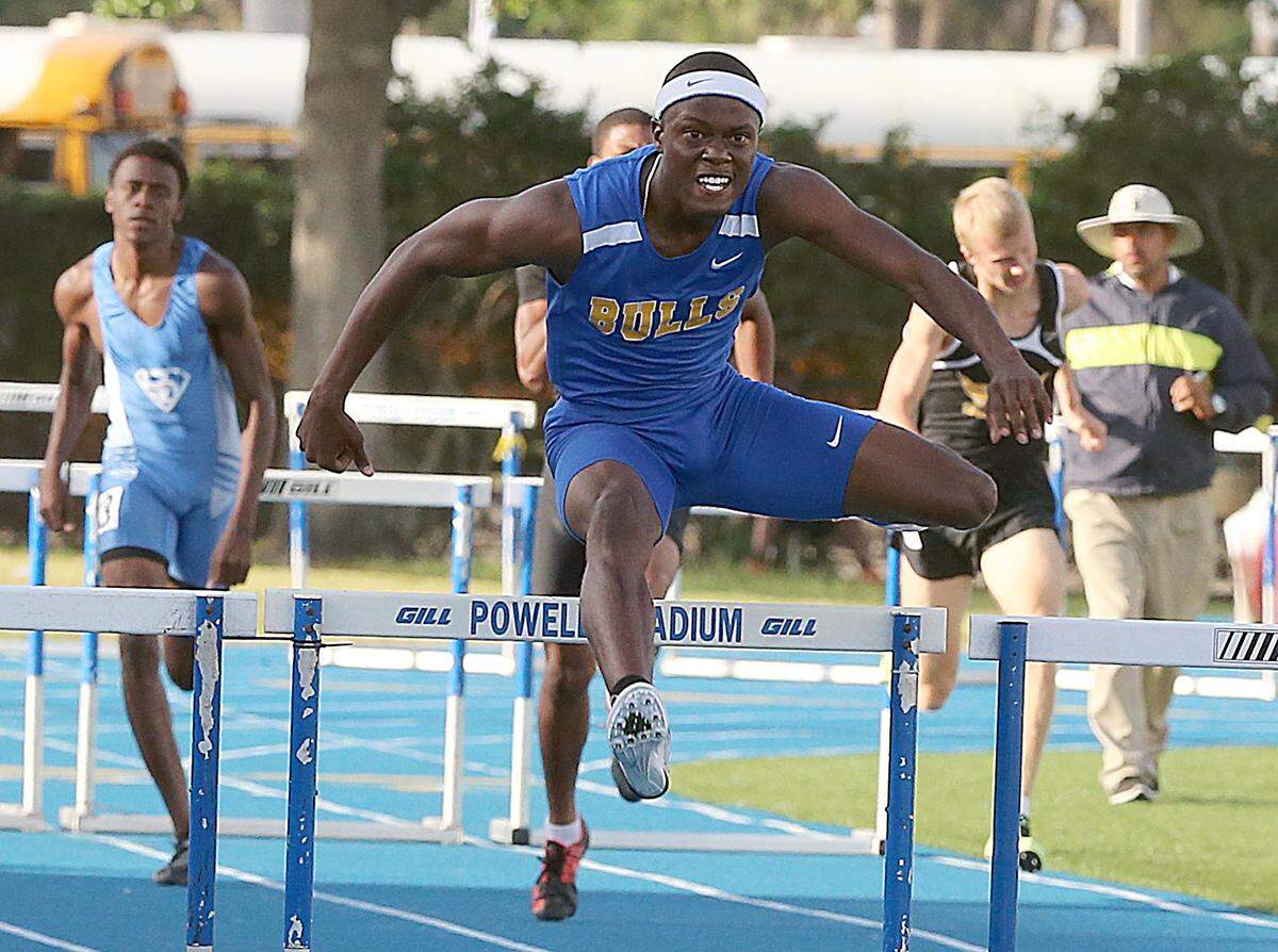 Athlete Thomas Burns, of Northwestern High School wins in the boys 300 meter Hurdles during the GMAC Track and Field Championship at Traz Powell Stadium in North Miami on Saturday, March 25, 2017.