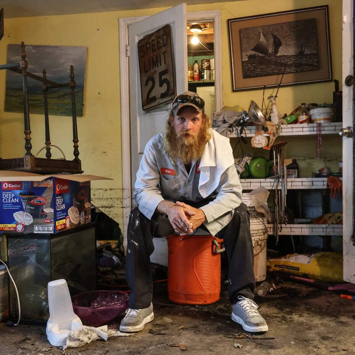 Shilo Carney, 35, takes a break from the clean-out process after discarding the majority of the contents in his home. On Monday, April 17, 2023, less than a week after unrelenting rainfall flooded the streets of the Edgewood neighborhood in Fort Lauderdale, residents continued to clean out their soaked homes. Many worked hard in hopes they’ll be able to salvage their homes and move back in.