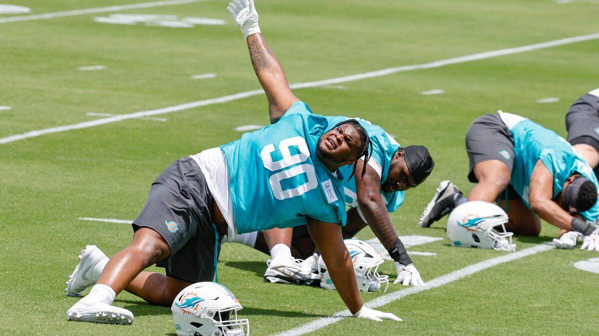 Miami Dolphins defensive tackle Kenneth Grant (90) runs through drills at Dolphins rookie minicamp at the Baptist Health Training Complex in Miami Gardens, Florida on Friday, May 9, 2025.