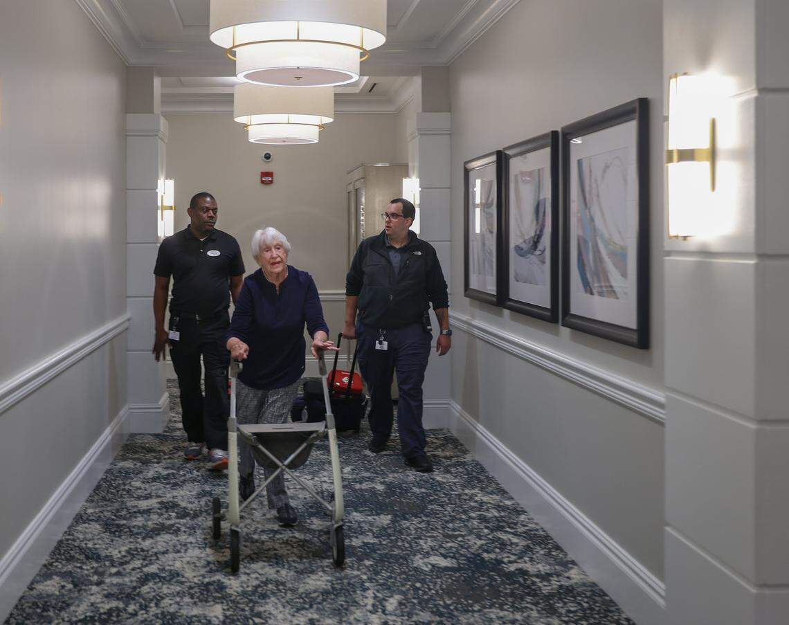 Fran Smolar, 88, center, leads medical responders to her apartment in Sinai Residences to take her husband’s blood pressure on Thursday, Jan. 29, 2026, in Boca Raton, Florida.