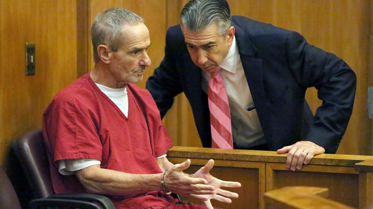 Attorney Jonathan Meltz speaks to his client Raul Prado, who claims he was wrongfully arrested under the identity of his twin brother, in court at the Richard E. Gerstein Justice Building on Tuesday, Oct. 23, 2018.
