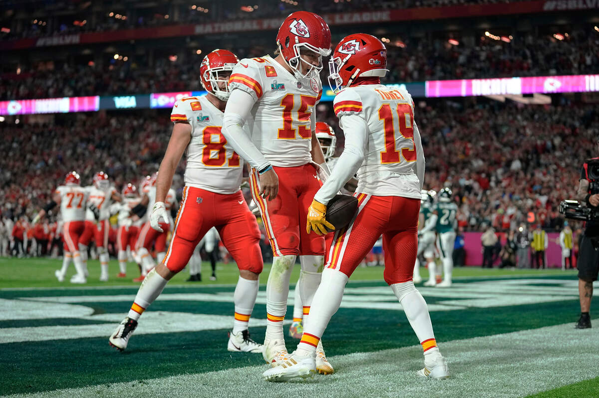 Kansas City Chiefs wide receiver Kadarius Toney (19) celebrates his touchdown with quarterback Patrick Mahomes (15) during the second half of the NFL Super Bowl 57 football game against the Philadelphia Eagles, Sunday, Feb. 12, 2023, in Glendale, Ariz. (AP Photo/Abbie Parr)