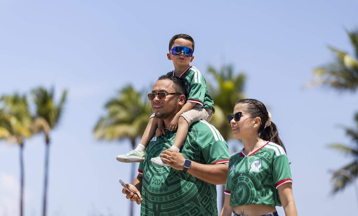 From left to right: Enrique Larios, Atlas Larios, 4, and Jocelyn Larios visit the FIFA Fan Festival Miami at Bayfront Park on Saturday, June 13, 2026, in downtown Miami, Fla.