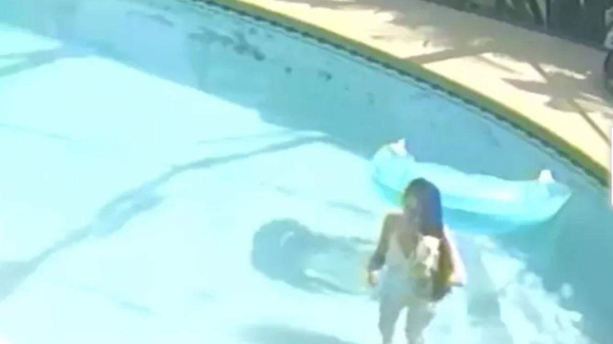 Erica Black is accused of drowing her dog in a pool in Florida as seen on home security video