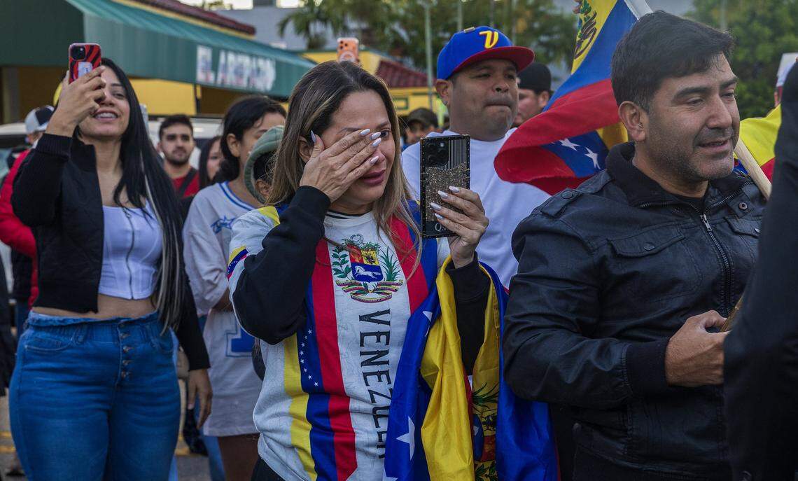 Jennifer Santillan reacts as she joined a group of Venezuelan exiles living in South Florida celebrating outside of El Arepazo in Doral, Florida, after the United States attacked Venezuela and captured Venezuelan leader Nicolás Maduro, on Jan. 3, 2026.