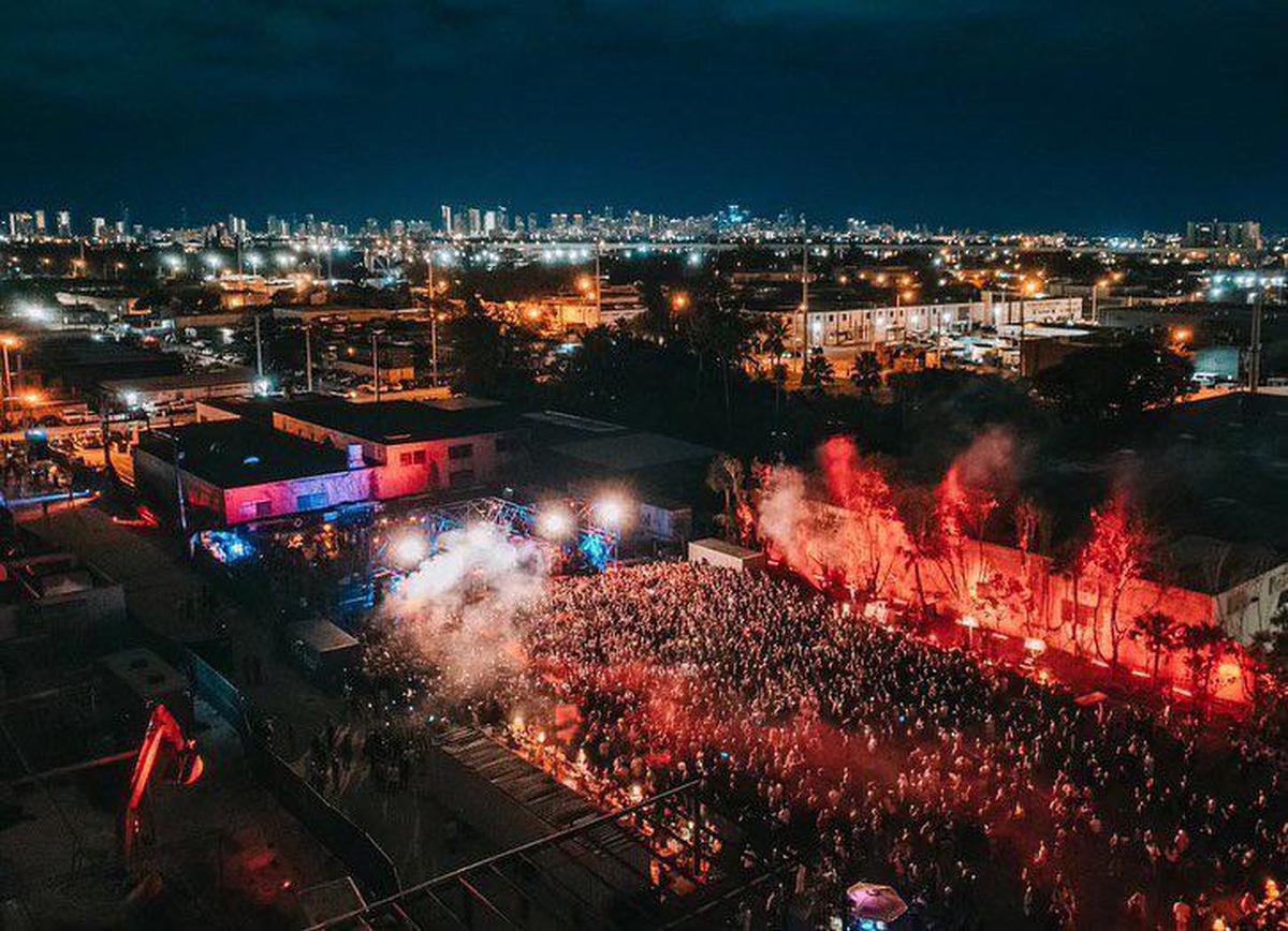 A drone shot shows a DJ performance at Factory Town in Hialeah in 2021. The site is a former mattress factory in east Hialeah’s industrial district that developer Avra Jain and partners are turning into a music and events venue.