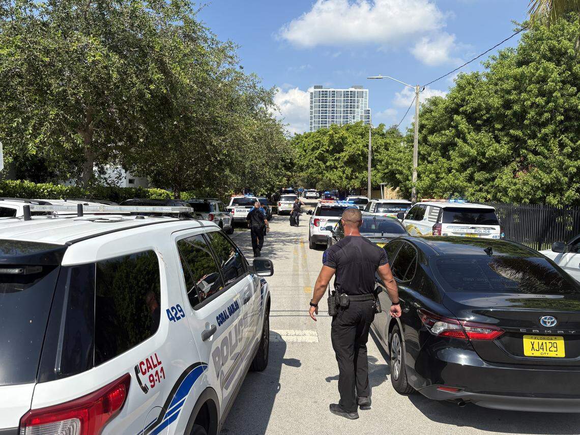 A heavy police presence on Shipping Avenue and Elizabeth Street in Coconut Grove on Friday morning, Aug. 22, 2025, after reports of a stolen car in the Gables led to a police chase and three Grove schools on lockdown.