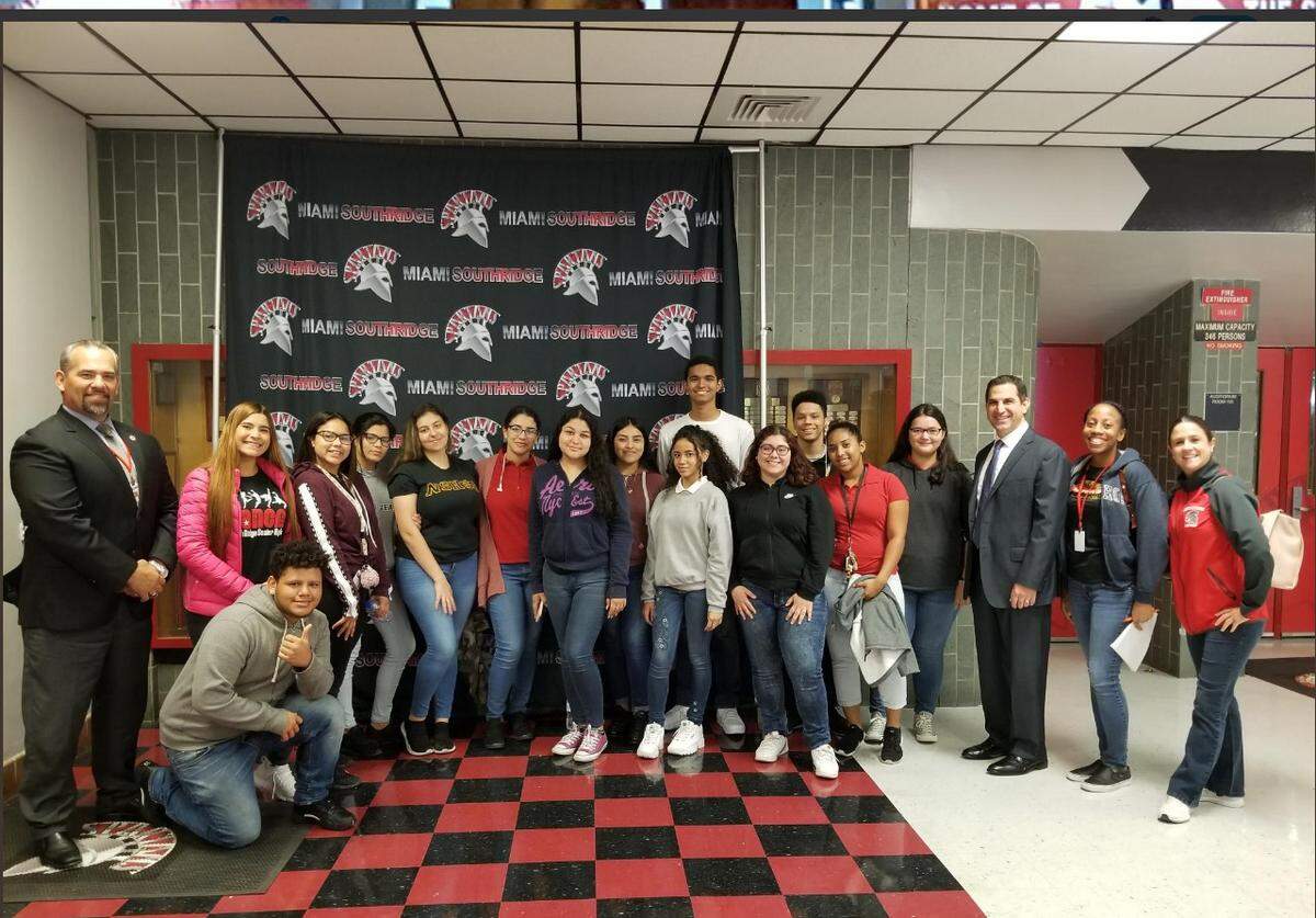 Children’s Trust CEO and president James Haj served as principal at Miami Southridge High School during Miami-Dade County’s 22nd annual Principal Today Event. Haj, third from right, is with students and Principal Humberto Miret, far left.